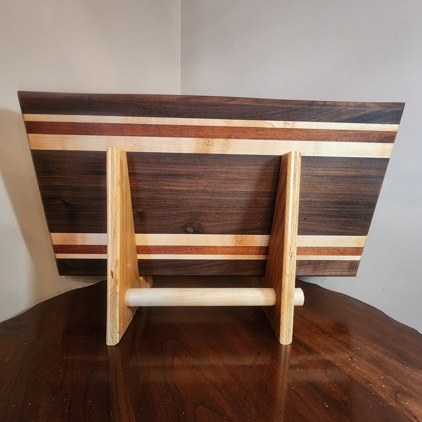 Walnut,maple,mahogany with walnut center. Food safe oil wax finish. 21.25"x11.25"x1.75"display stand sold separately
